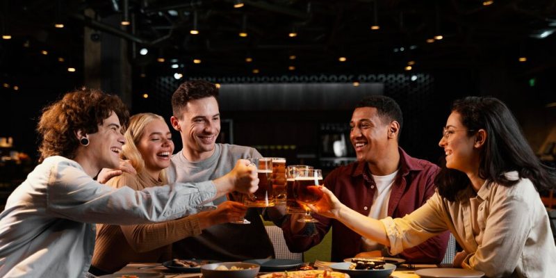 medium-shot-happy-friends-with-beer-mugs_23-2148872451